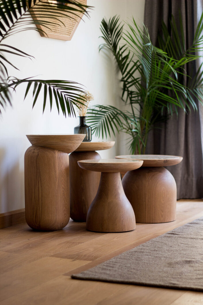 An assortment of wooden side tables.