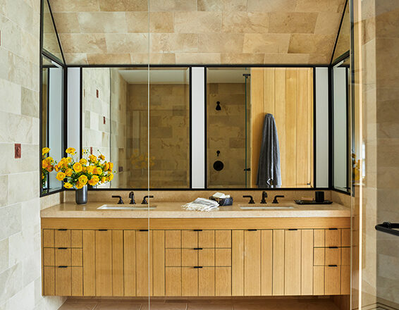 Primary bathroom with oak cabinetry