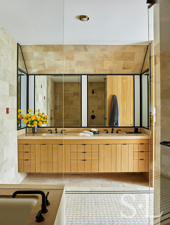 Primary bathroom with oak cabinetry