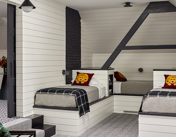 Historic home attic bunk-room in black and white palette