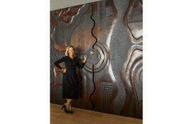 Suzanne Lovell with custom sculpted sliding doors by Caleb Woodard