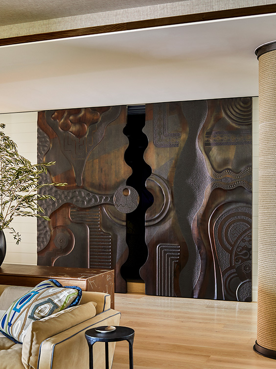 Sliding doors by Caleb Woodard in family room of Naples penthouse designed by Suzanne Lovell