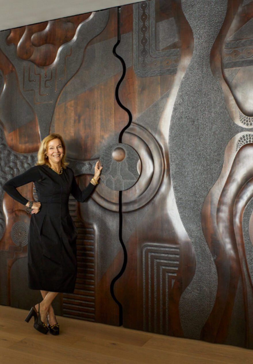 Suzanne Lovell in a residence she designed in Naples, FL with a custom door by Caleb Woodard